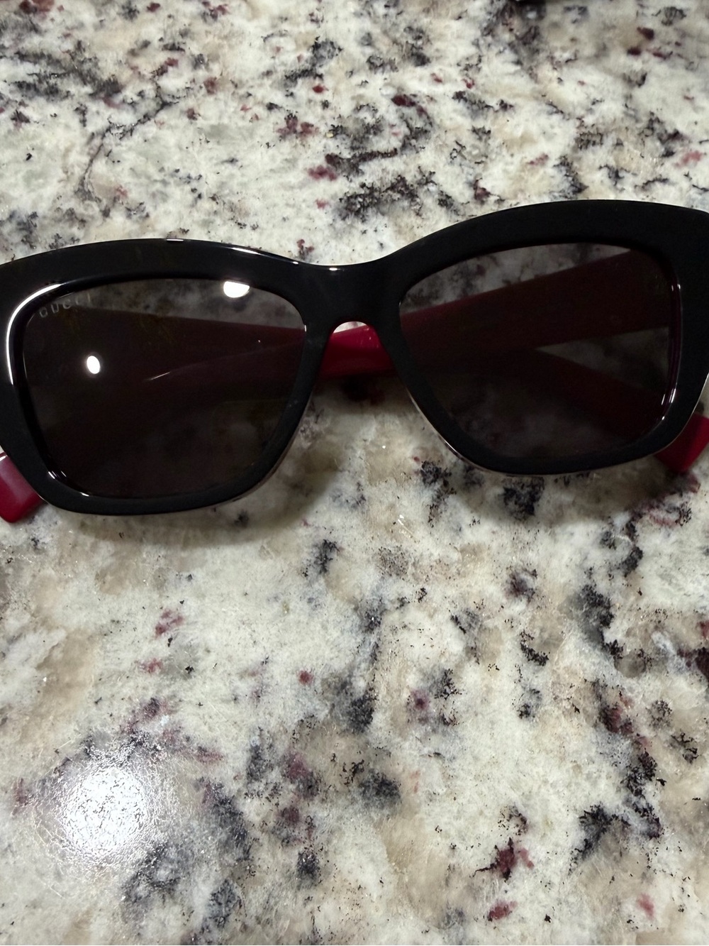 Gucci Black Frame Sunglasses with Red Temples